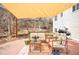 Cozy outdoor patio area with comfortable seating, table, and grill at 16012 E Floyd Ave, Aurora, CO 80013