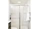 Clean shower with sliding glass door and built in caddy at 16012 E Floyd Ave, Aurora, CO 80013