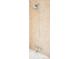 Close-up of shower fixtures and tile in neutral color tones at 16012 E Floyd Ave, Aurora, CO 80013