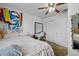 Bedroom with light walls, ceiling fan, plush carpet, and a window at 18619 E 50Th Pl, Denver, CO 80249