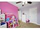 Bedroom with ceiling fan and large window for natural light at 18619 E 50Th Pl, Denver, CO 80249