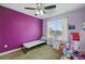 Bedroom with ceiling fan and large window for natural light at 18619 E 50Th Pl, Denver, CO 80249