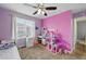Bright bedroom featuring a ceiling fan and window with blinds at 18619 E 50Th Pl, Denver, CO 80249