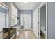 Entryway features neutral colored walls, stairwell and door to the downstairs bathroom at 18619 E 50Th Pl, Denver, CO 80249