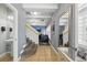 Beautiful entryway with stairs leading to the living room and a half-bathroom at 18619 E 50Th Pl, Denver, CO 80249