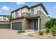 Charming two-story home featuring brick driveway and colorful front door at 18619 E 50Th Pl, Denver, CO 80249