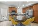 Spacious kitchen with kitchen island, stainless steel appliances and tile floors at 18619 E 50Th Pl, Denver, CO 80249