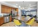 Eat-in kitchen with stainless appliances and large island with granite countertops and seating at 18619 E 50Th Pl, Denver, CO 80249