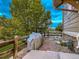 Exterior view of stone patio and grill featuring partial views of the back yard at 7648 S Sicily Way, Aurora, CO 80016