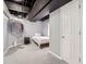 Basement bedroom with small bed and closet underneath the exposed ceiling at 7648 S Sicily Way, Aurora, CO 80016