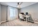 Bedroom with white desk, gaming chair, and a large window with natural light at 7648 S Sicily Way, Aurora, CO 80016