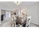 View of the open floor plan with stairs and dining room at 7648 S Sicily Way, Aurora, CO 80016