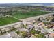 Aerial view showcases a sports complex with vibrant green fields amidst a neighborhood setting at 11165 W 58Th Ave, Arvada, CO 80002