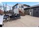Backyard patio with outdoor dining set, shed, and trampoline, perfect for entertaining and recreation at 11165 W 58Th Ave, Arvada, CO 80002