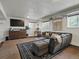 Finished basement with plush seating and stylish decor at 11165 W 58Th Ave, Arvada, CO 80002