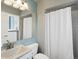 Bathroom featuring blue accent wall and shower at 11165 W 58Th Ave, Arvada, CO 80002