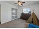 Bedroom with sliding closet, window and ceiling fan at 11165 W 58Th Ave, Arvada, CO 80002