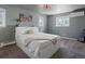 Bedroom featuring neutral colors, ample light, and a white bed at 11165 W 58Th Ave, Arvada, CO 80002