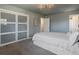 Bedroom with sliding closet and modern lighting at 11165 W 58Th Ave, Arvada, CO 80002
