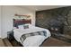 Bedroom featuring stone fireplace and cozy decor at 11165 W 58Th Ave, Arvada, CO 80002