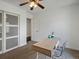 Bright bedroom with neutral carpet, natural light, and a simple desk setup at 11165 W 58Th Ave, Arvada, CO 80002