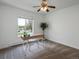 Bright bedroom with neutral carpet, natural light, and a simple desk setup at 11165 W 58Th Ave, Arvada, CO 80002