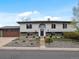 Charming two-story home featuring a well-maintained lawn and a spacious two-car garage at 11165 W 58Th Ave, Arvada, CO 80002