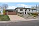 Two-story home featuring a well-maintained lawn and a spacious two-car garage at 11165 W 58Th Ave, Arvada, CO 80002