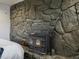 Close up of fireplace with stone surround at 11165 W 58Th Ave, Arvada, CO 80002