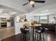 Eat in kitchen with stainless appliances, white cabinets, and wood floors at 11165 W 58Th Ave, Arvada, CO 80002