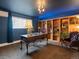 Inviting office with built-in shelving, a stylish desk, and a comfortable chair, bathed in warm light at 11165 W 58Th Ave, Arvada, CO 80002