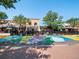 Vibrant street view featuring colorful sidewalk art and outdoor patios for local restaurants and shops at 11165 W 58Th Ave, Arvada, CO 80002