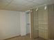 Bedroom featuring neutral decor with closet and custom lighting at 7721 S Curtice Way # B, Littleton, CO 80120
