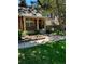 Charming brick home with a inviting front entrance and lush landscaping, featuring a 'For Sale' sign at 7721 S Curtice Way # B, Littleton, CO 80120