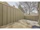 Private patio with wooden fencing and concrete surface, perfect for outdoor living at 7721 S Curtice Way # B, Littleton, CO 80120
