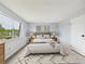 Bright bedroom with large window, neutral carpet and decorative rug at 190 E Highline Cir # 302, Centennial, CO 80122