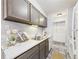 Kitchen featuring wood cabinets, and stainless steel sink at 190 E Highline Cir # 302, Centennial, CO 80122