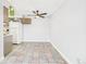Bright eat-in kitchen featuring tile flooring, white appliances, and ceiling fan at 190 E Highline Cir # 302, Centennial, CO 80122