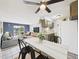 Charming living room that flows into the kitchen featuring a large fan and tiled flooring at 190 E Highline Cir # 302, Centennial, CO 80122