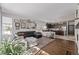 Open-concept living area connecting to the kitchen, featuring a cozy seating arrangement at 8850 W Cannes Dr, Littleton, CO 80127