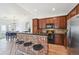 Stylish kitchen with stainless steel appliances, granite countertops, and a breakfast bar with seating at 7777 E 23Rd Ave # 203, Denver, CO 80238