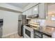 Efficient kitchen with stainless steel refrigerator and modern range at 5995 W Hampden Ave # 2G, Denver, CO 80227