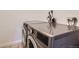 A modern front load washer and dryer set in the laundry room at 5995 W Hampden Ave # 2G, Denver, CO 80227