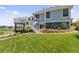 A lush backyard with garden, a deck, and outdoor seating, creating a serene escape at 16485 E 117Th Ave, Commerce City, CO 80022