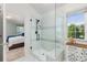Bathroom with a large glass shower and a view from the window at 16485 E 117Th Ave, Commerce City, CO 80022