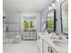 Bathroom with a large shower, double vanity sinks, quartz countertops, and nice mirrors at 16485 E 117Th Ave, Commerce City, CO 80022