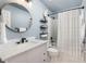 Bathroom featuring modern fixtures, a marble countertop vanity, and a shower with a curtain at 16485 E 117Th Ave, Commerce City, CO 80022