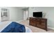 Spacious primary bedroom featuring a dresser and an ensuite bathroom at 16485 E 117Th Ave, Commerce City, CO 80022