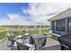 An inviting outdoor deck with seating, grill, and golf course views for outdoor living at 16485 E 117Th Ave, Commerce City, CO 80022