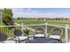 Cozy outdoor deck with comfortable wicker seating, ideal for enjoying scenic views and relaxation at 16485 E 117Th Ave, Commerce City, CO 80022